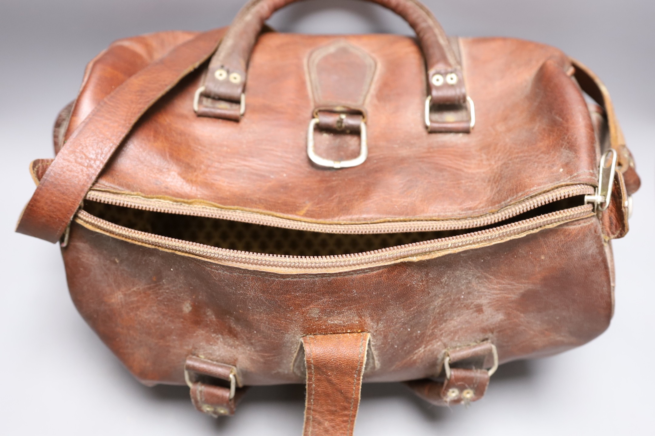 A brown leather Gladstone type bag